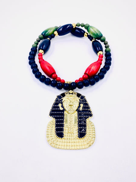 Necklace with colorful beads and a pharaoh pendant on a white background