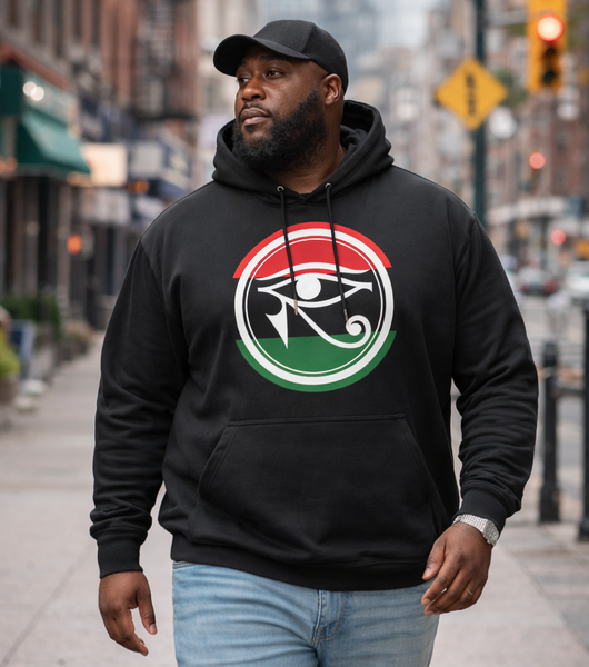 Man wearing a black RBG HERU hoodie with a logo walking on a city street.