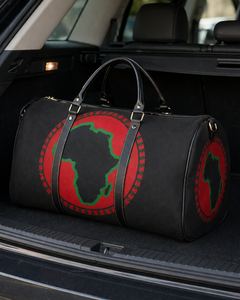 Black duffel bag with red and green design in a car trunk