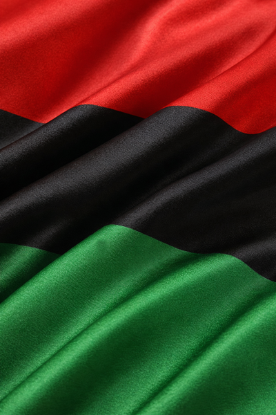 Close-up of the Pan-African flag with red, black, and green colors.