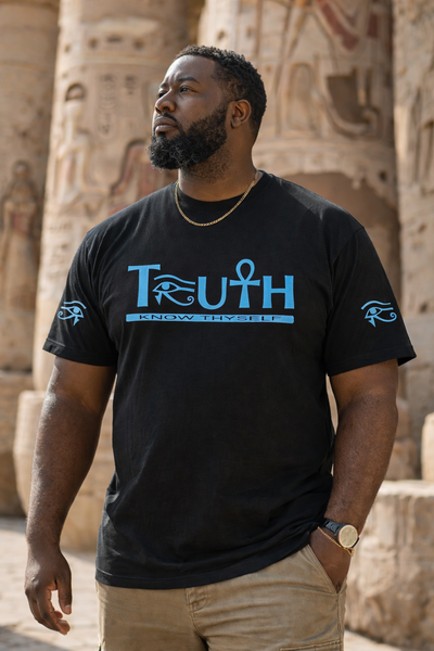 Man wearing a black t-shirt with 'TRUTH' and 'Know Thyself' text, standing in front of ancient Egyptian architecture.