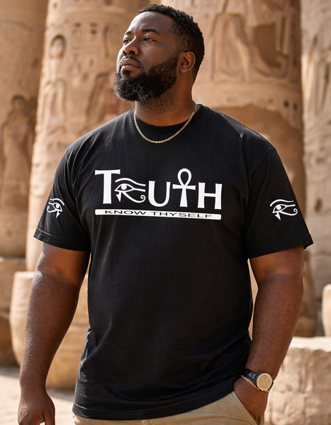 Man wearing a black t-shirt with 'TRUTH' and Egyptian symbol design, standing in front of ancient temple architecture.