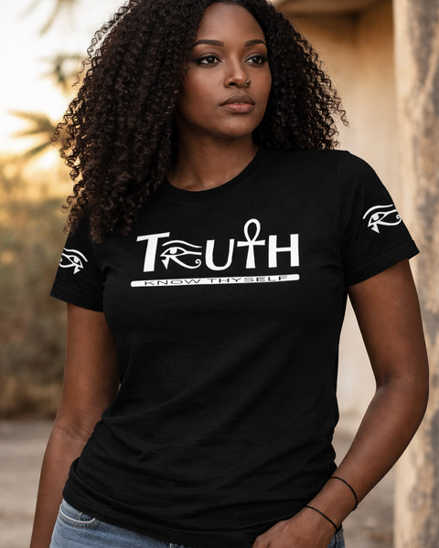 Woman wearing a black t-shirt with 'TRUTH' printed on it, standing outdoors.