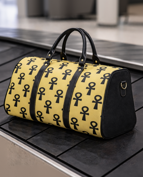 Yellow duffel bag with black patterns on a luggage carousel